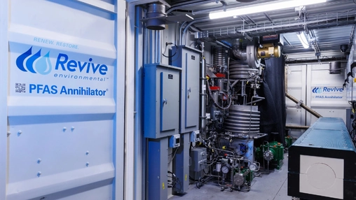 Interior view of PFAS destruction unit with pipes, tanks and control panels