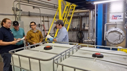 Industrial remediation facility with treatment tanks and processing equipment